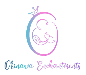 Large blue, purple and pink O with a cursive E in the center. The O has a crown and the E has a mermaid tail.